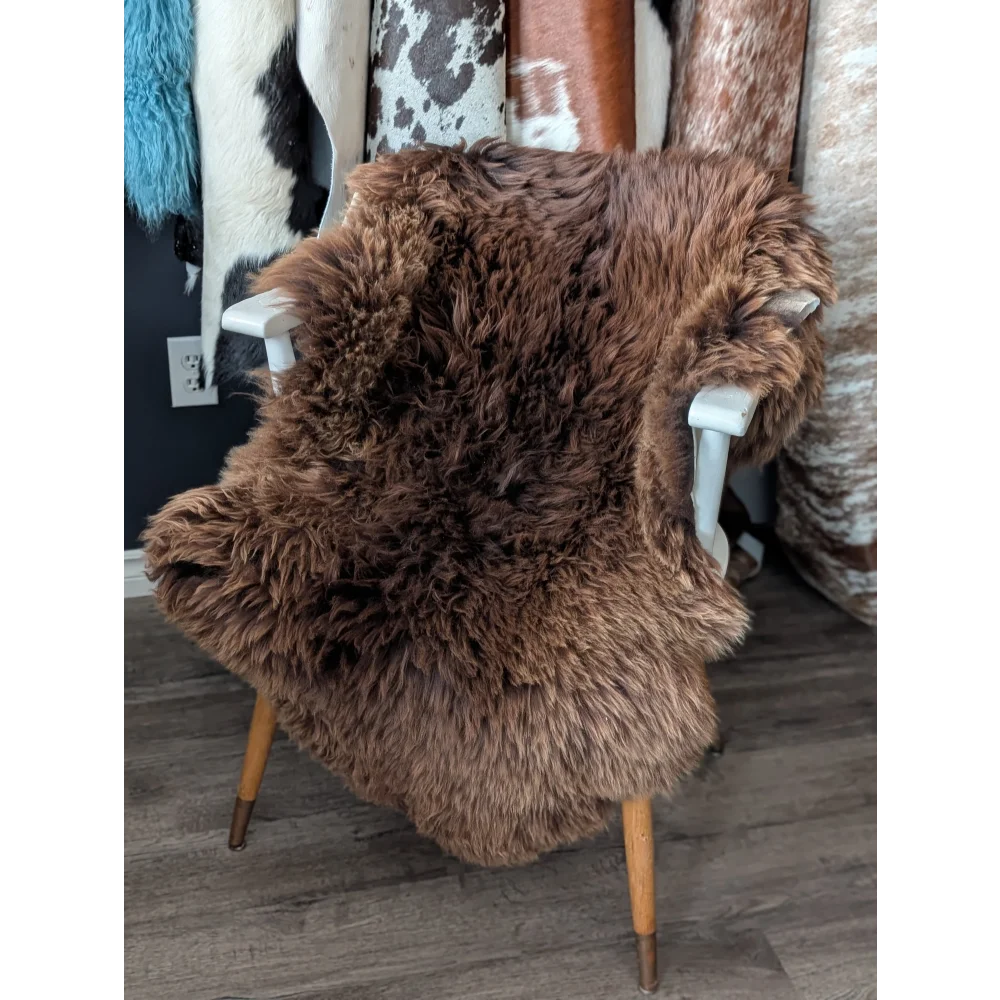 Gorgeous fluffy 48x32 rare British sheepskin rug on white chair