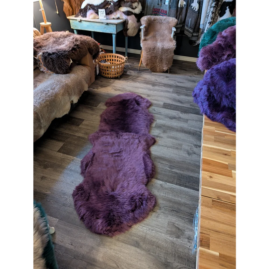 Gorgeous plum purple double merino sheepskin rug with natural fur texture
