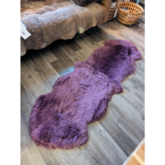 Gorgeous merino sheepskin rug in plum purple, plush lavender fur texture