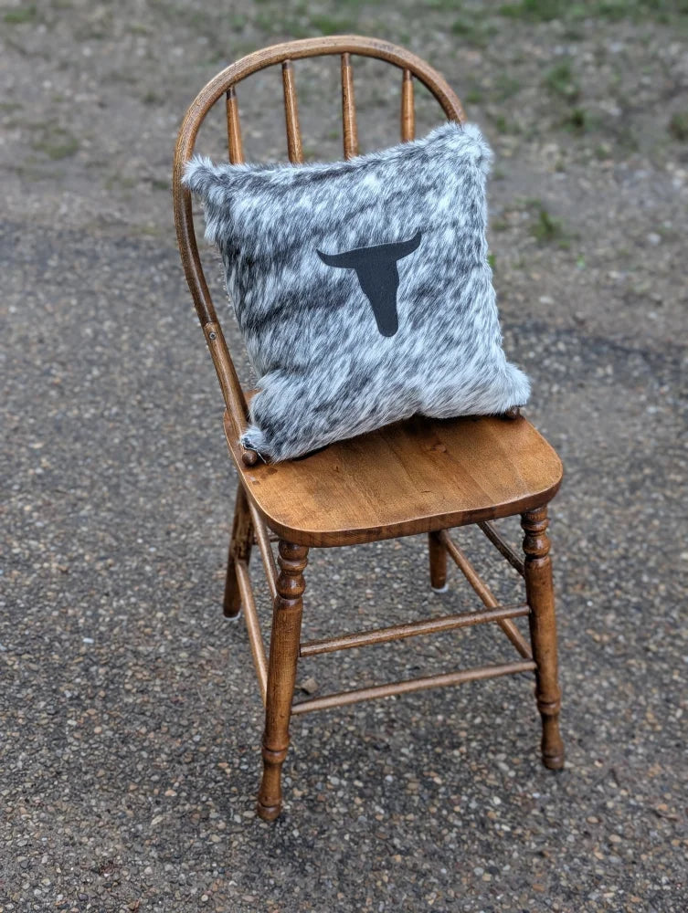 Gray and white speckled double sided cowhide cushion with black steer head silhouette from mini moo double collection