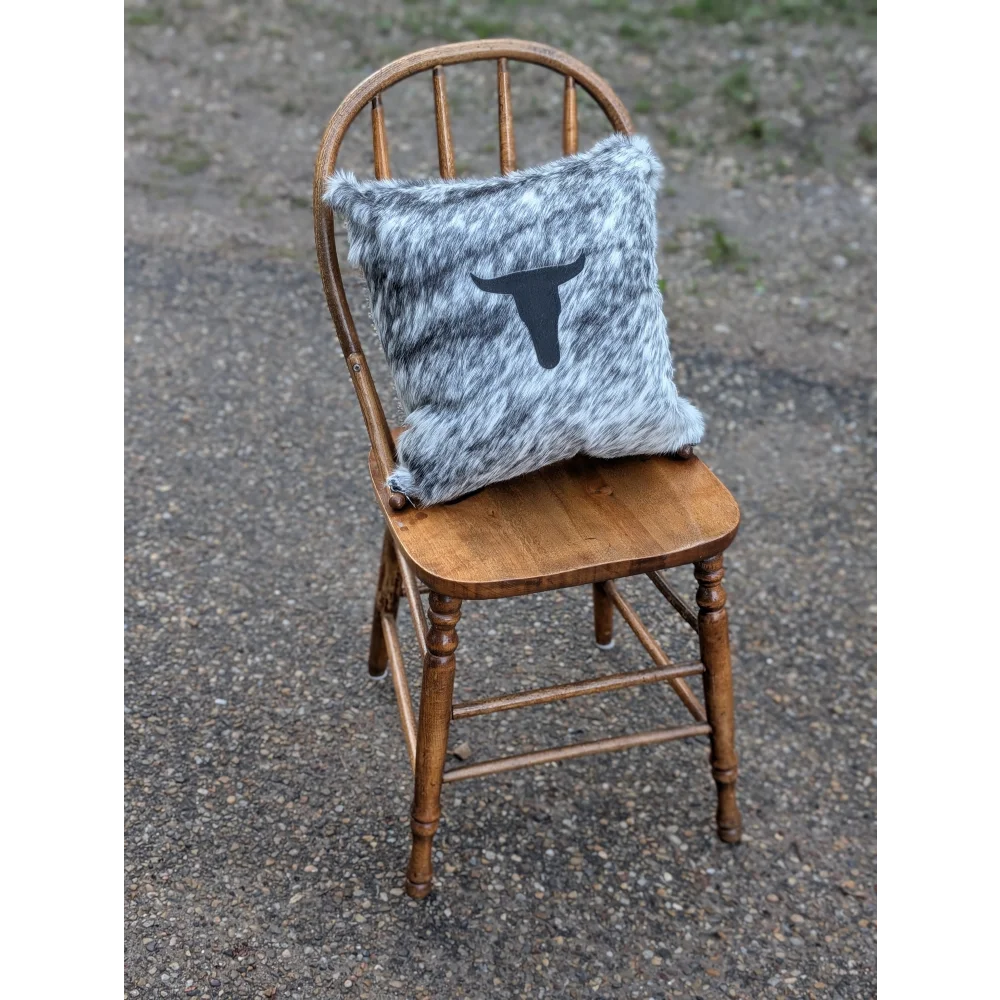 Gray and white speckled double sided cowhide cushion with black steer head silhouette from mini moo double collection