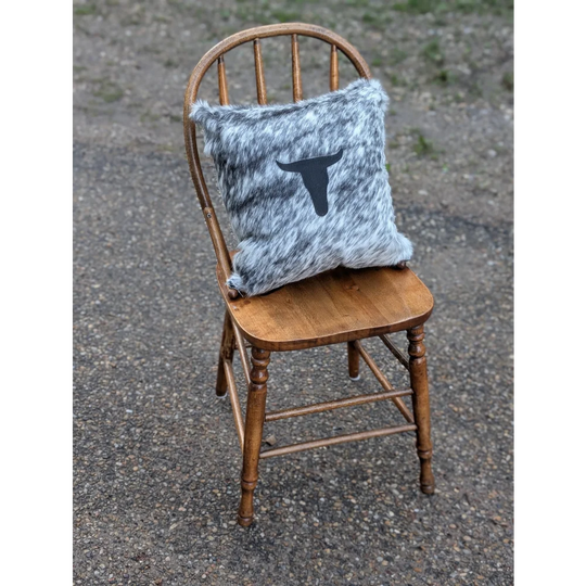 Gray and white speckled double sided cowhide cushion with black steer head silhouette from mini moo double collection