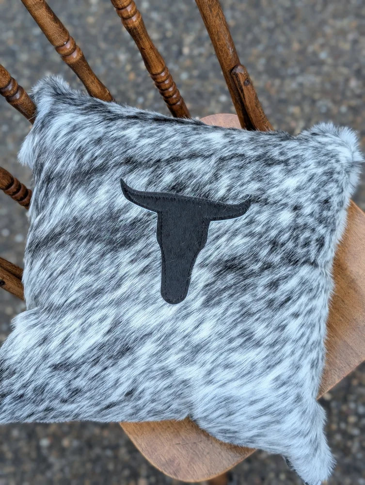 Gray and white speckled double sided cowhide cushion with black stitched bull head emblem from mini moo double