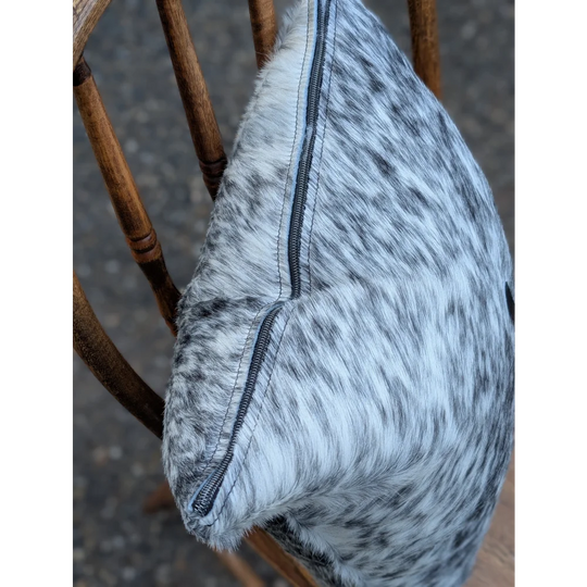 A soft gray and black double sided cowhide cushion with a visible zipper from mini moo double collection