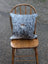 Gray and white double sided cowhide cushion mini moo with brown felt pig face appliqué on speckled cowhide