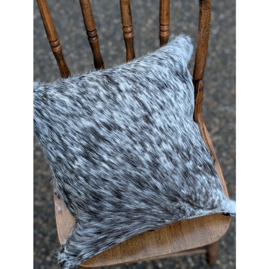 Gray and black speckled double sided cowhide cushion mini moo double with a soft textured surface