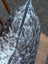 Gray and white spotted double sided cowhide cushion mini moo with a black zipper on the side
