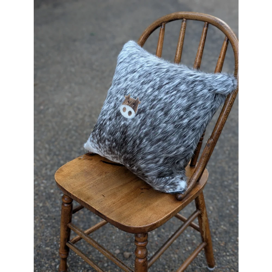 Gray and white speckled double sided cowhide cushion with a mini moo double brown pig face appliqué