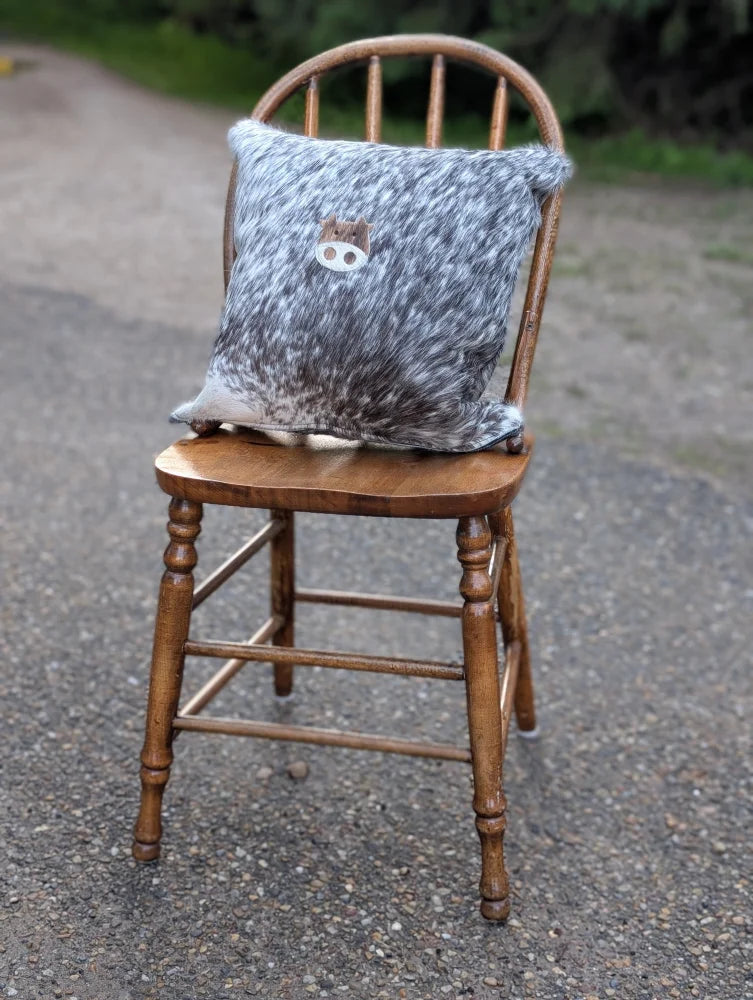 Gray and white double sided cowhide cushion mini moo with small embroidered animal face on speckled cowhide