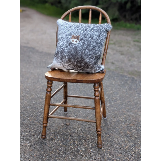 Gray and white double sided cowhide cushion mini moo with small embroidered animal face on speckled cowhide