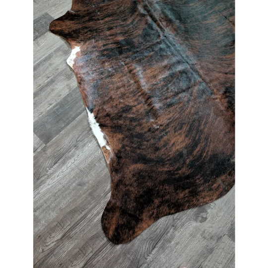 Brown and black cowhide rug with white patches large cowhide perfect for adding style with beautiful rugs
