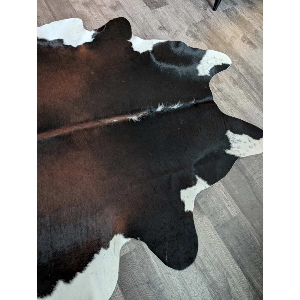 Large cowhide rug es04 with brown black and white patches in a natural irregular shape perfect for beautiful rugs