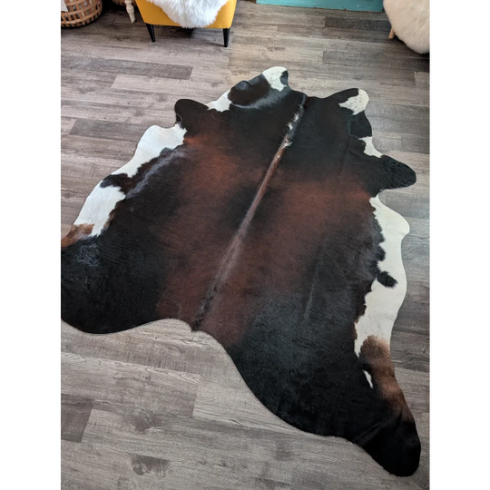 Large cowhide rug es04 featuring a beautiful black white and brown natural cowhide pattern measuring 80 by 74 inches