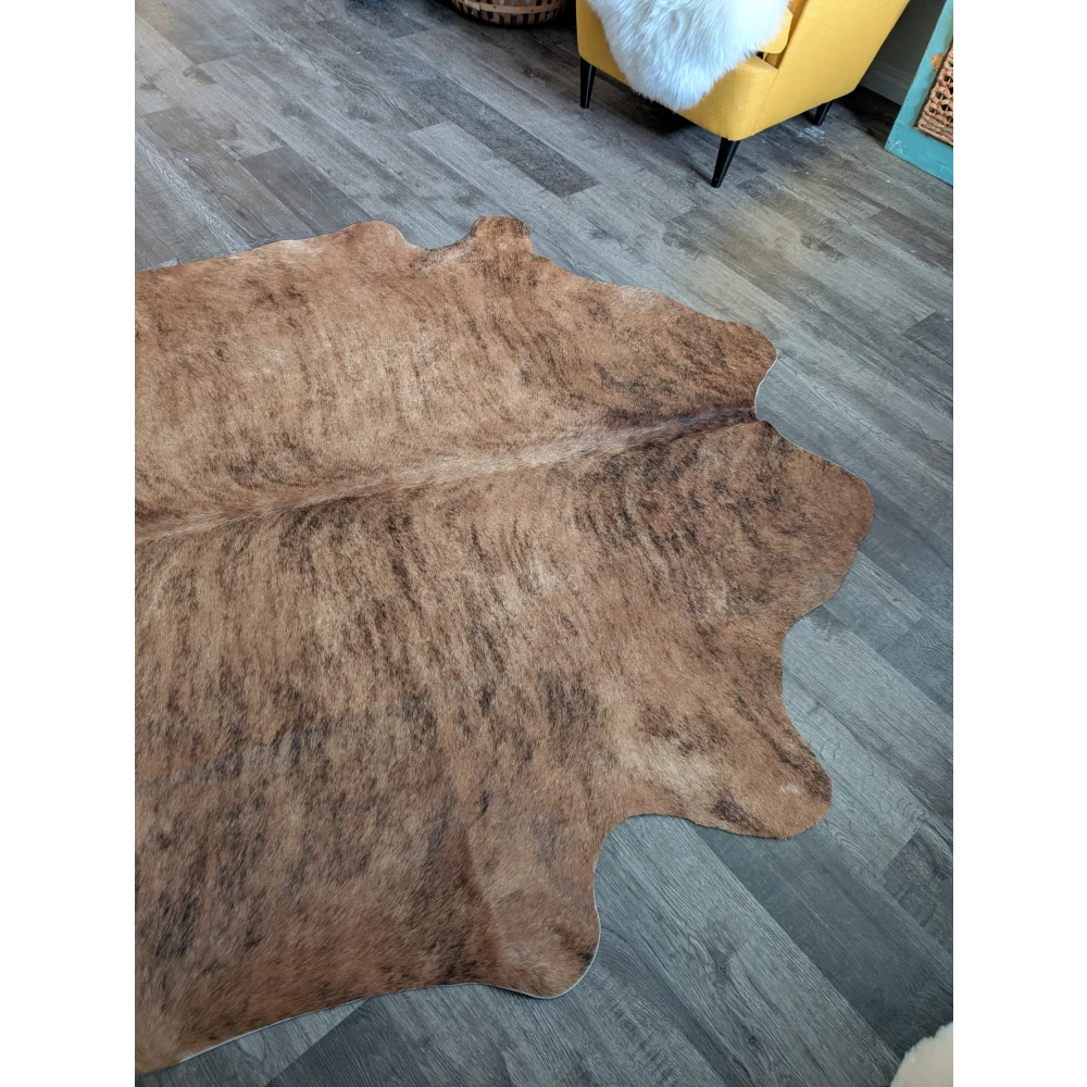 Brown and tan large cowhide rug with natural fur texture beautiful rugs perfect for home decor 75.5 x 66 inches
