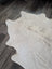 Large white cowhide rug es11 with natural edges and subtle grayish brown markings perfect for beautiful rugs