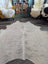 Large cowhide rug es11 80 x 72 natural white with subtle grayish markings and soft textured surface beautiful rugs