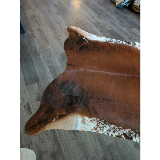 Beautiful large cowhide rug es12 with brown and white natural fur texture perfect for cozy decor