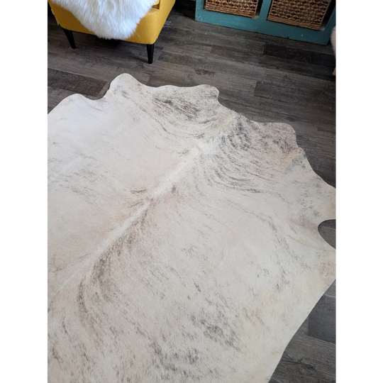 Large cowhide rug es24 with natural tones and soft textured surface featuring subtle grayish brown markings