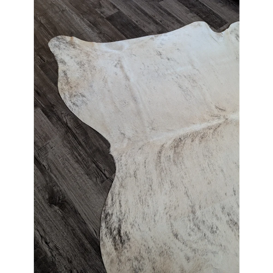 Large cowhide rug in white and gray speckled natural edges perfect for beautiful rugs and home decor
