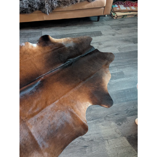 Large cowhide rug es701 with beautiful gradient brown tones and unique irregular edges perfect for stylish decor