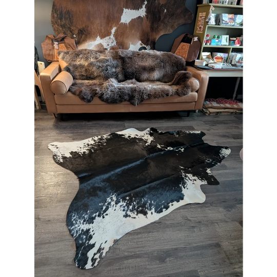 Large cowhide rug with black and white natural irregular patches perfect for beautiful rugs and home decor
