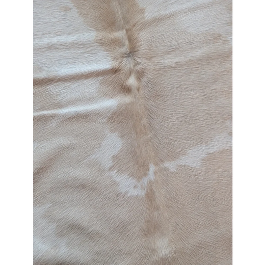 Beige and white large cowhide rug with a natural textured surface a beautiful cowhide rug perfect for any space