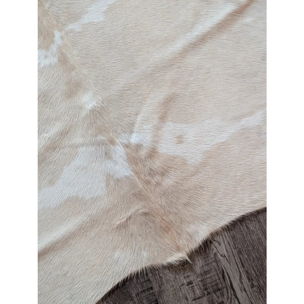 Beige and white large cowhide rug with natural textured surface beautiful rugs for home decor
