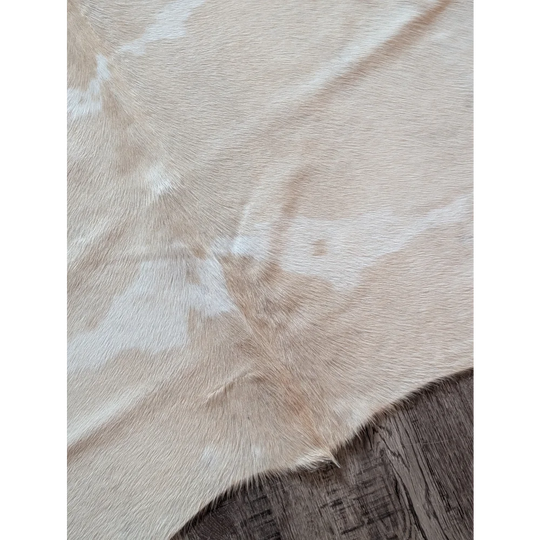 Beige and white large cowhide rug with natural textured surface beautiful rugs for home decor