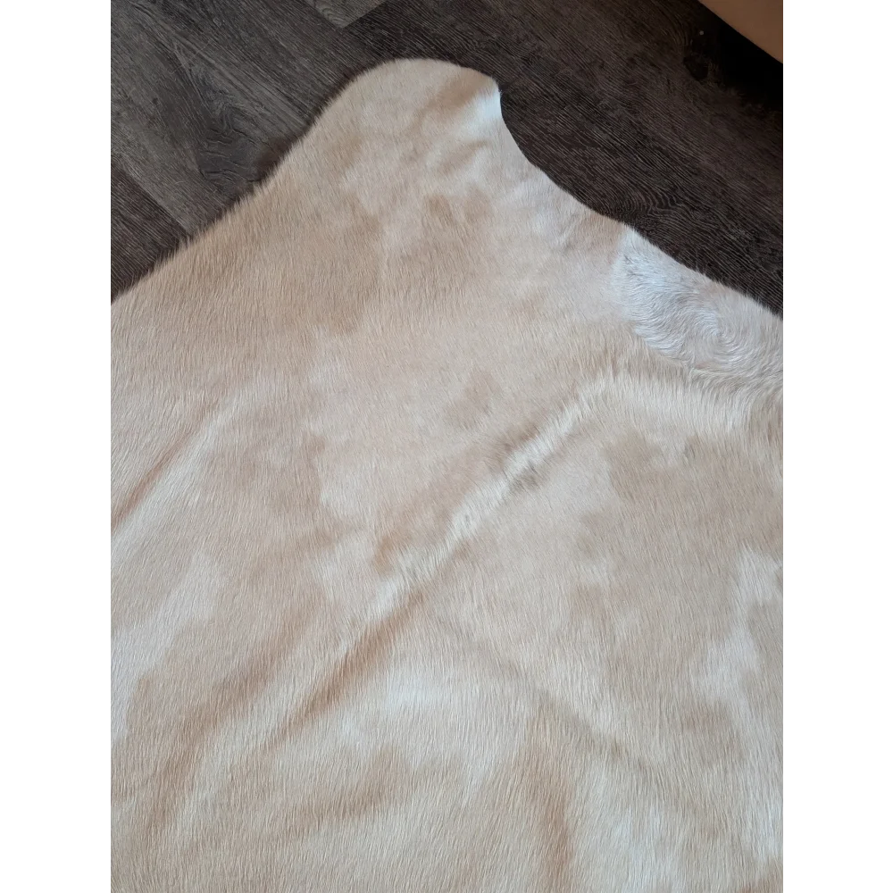 Cream-colored large cowhide rug es703 with soft natural fur and subtle tone variations perfect among beautiful rugs