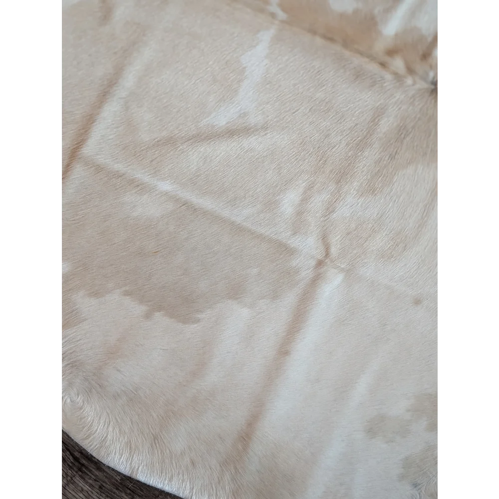 Cream-colored large cowhide rug with natural soft texture and subtle white patches beautiful rugs es703