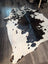 Large cowhide rug es706 with black and white natural irregular patches showcasing unique characteristics