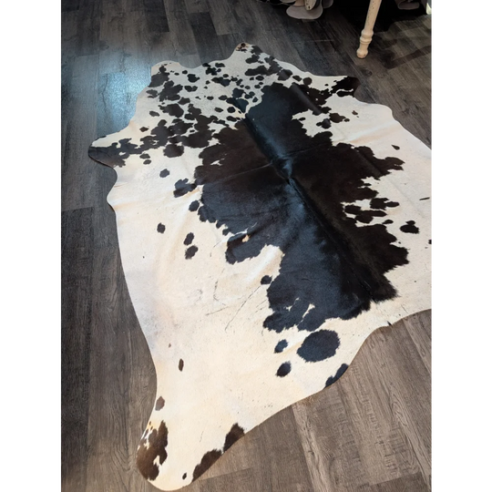 Large cowhide rug es706 with black and white natural irregular patches showcasing unique characteristics