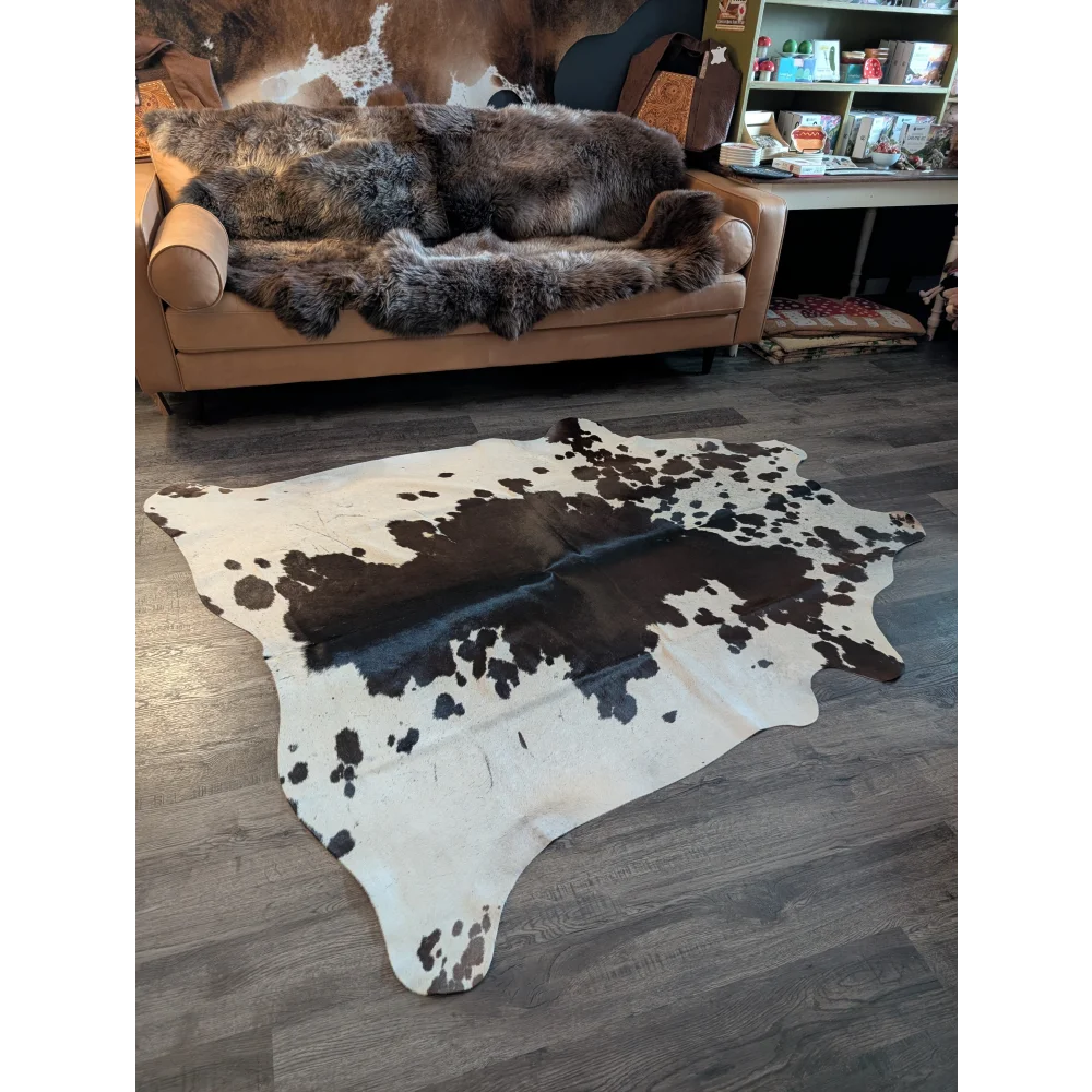 Large cowhide rug with unique black and white spotted pattern natural cowhide perfect for stylish floor decor