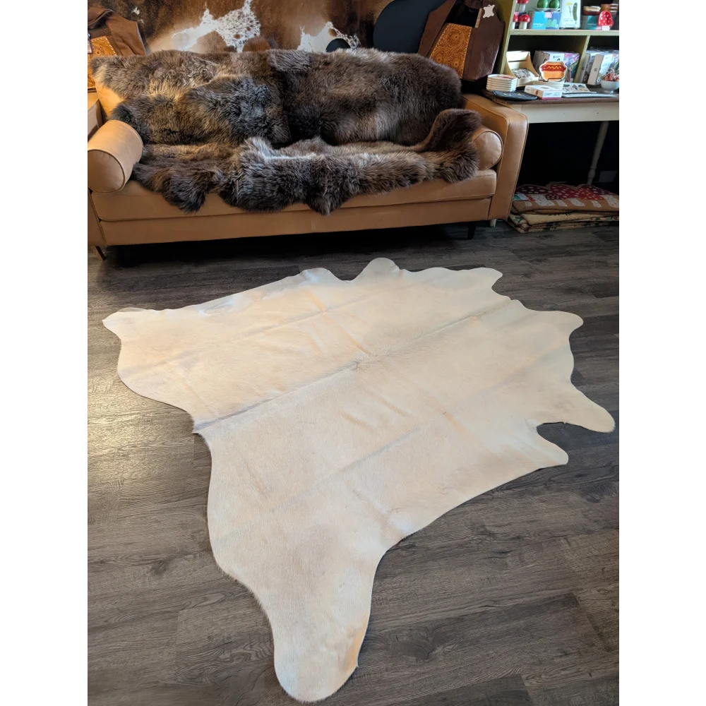 Large cowhide rug es707 in beautiful white cream with soft texture and natural irregular edges perfect for stylish spaces