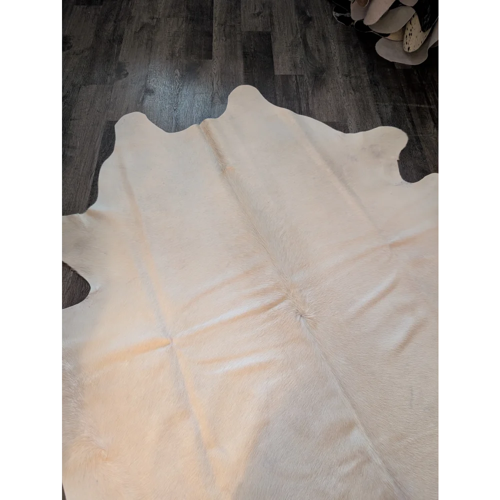 Beautiful large cream cowhide rug es707 with natural edges and soft textured surface perfect for stylish spaces