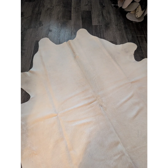 Beautiful large cream cowhide rug es707 with natural edges and soft textured surface perfect for stylish spaces