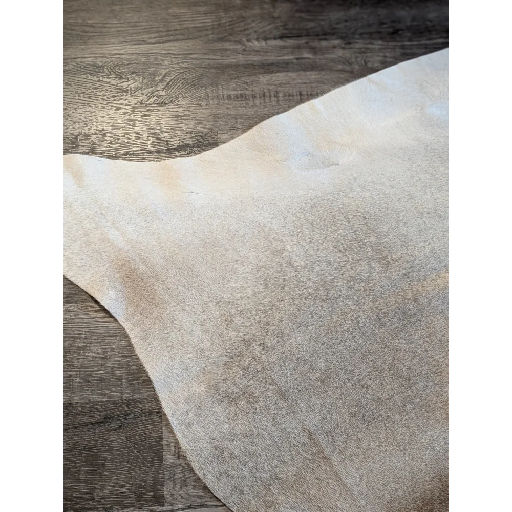 Large beautiful cowhide rug es708 features an off-white soft texture with natural grain and subtle tone variations