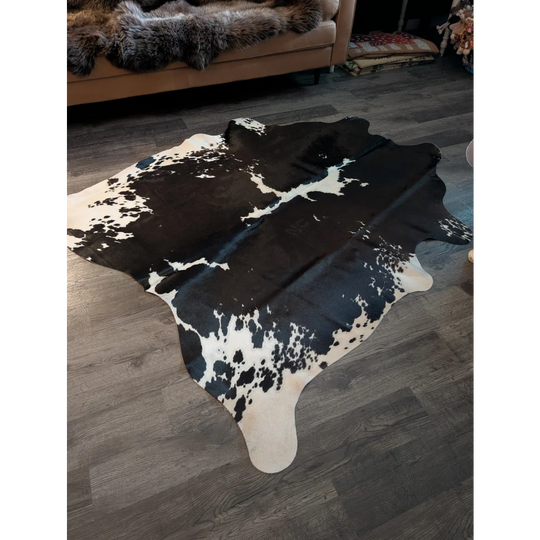 Beautiful large cowhide rug with black and white natural irregular patches perfect for stylish home decor