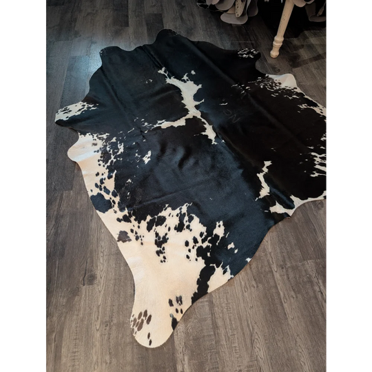 Large cowhide rug with beautiful black and white natural irregular patches perfect for stylish home decor