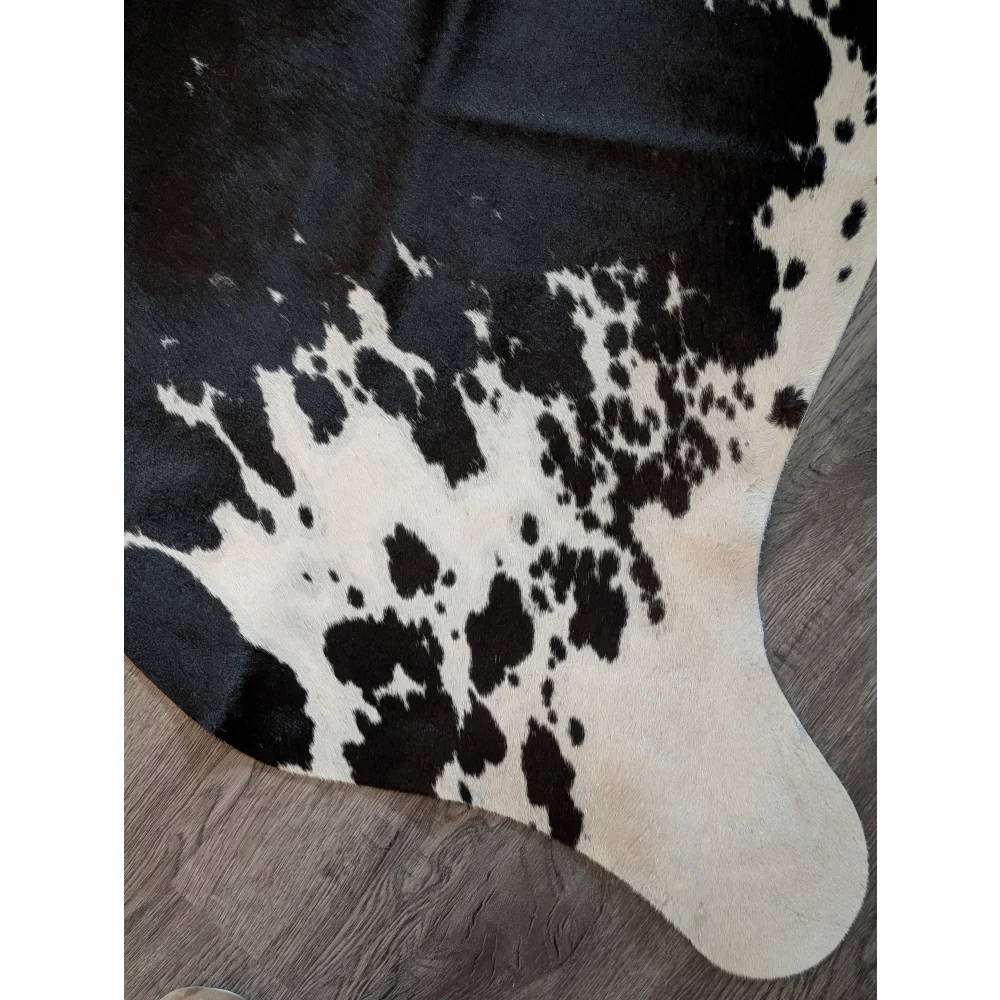 Large cowhide rug with natural black and white irregular patches perfect for beautiful rugs and home decor