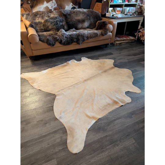 Beige large cowhide rug es717 with unique characteristics natural irregular edges and soft textured surface