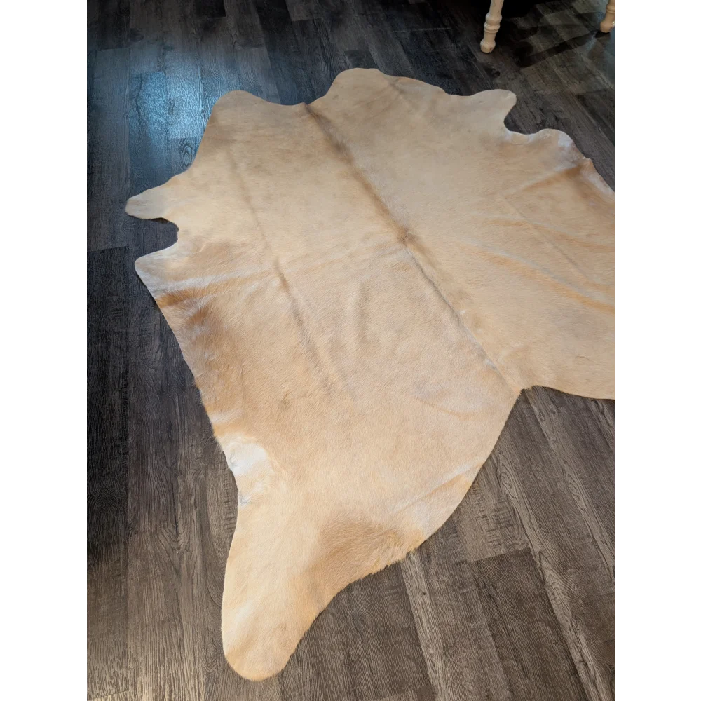 Natural tan large cowhide rug es717 with soft fuzzy texture and unique irregular edges perfect for home decor