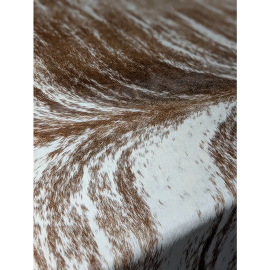 Extra large cowhide rug with brown and white markings, natural texture