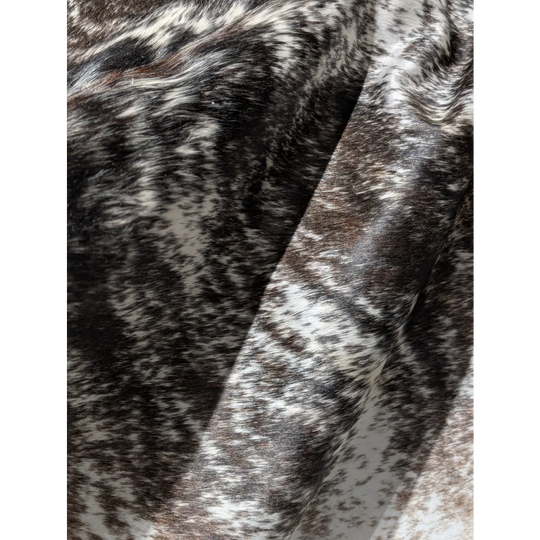 Extra large cowhide rug with black and white speckled plush fur