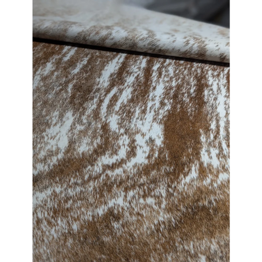 Extra large cowhide rug with brown white speckled textured cushion cover
