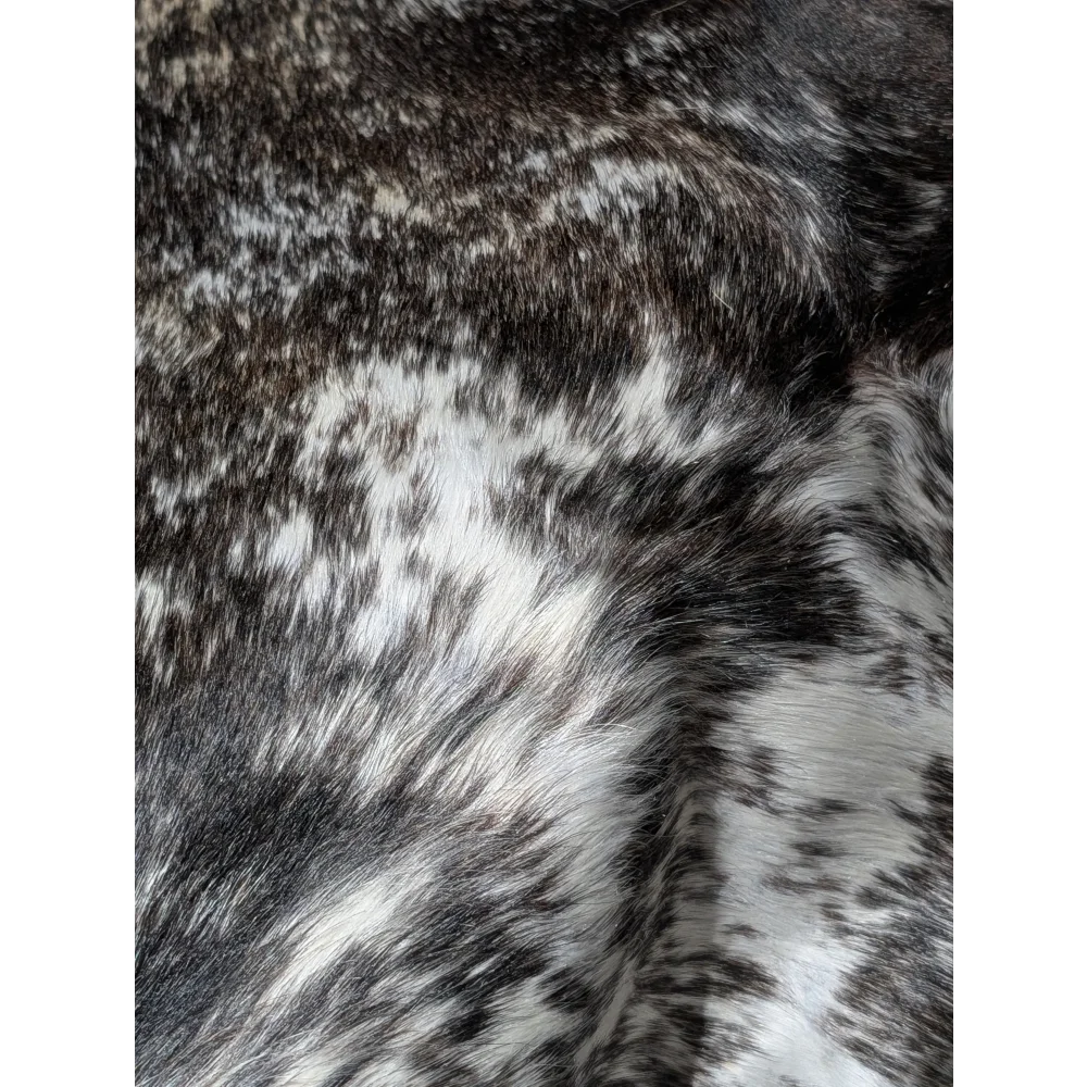 Extra large cowhide rug with gray and white speckled faux fur blanket