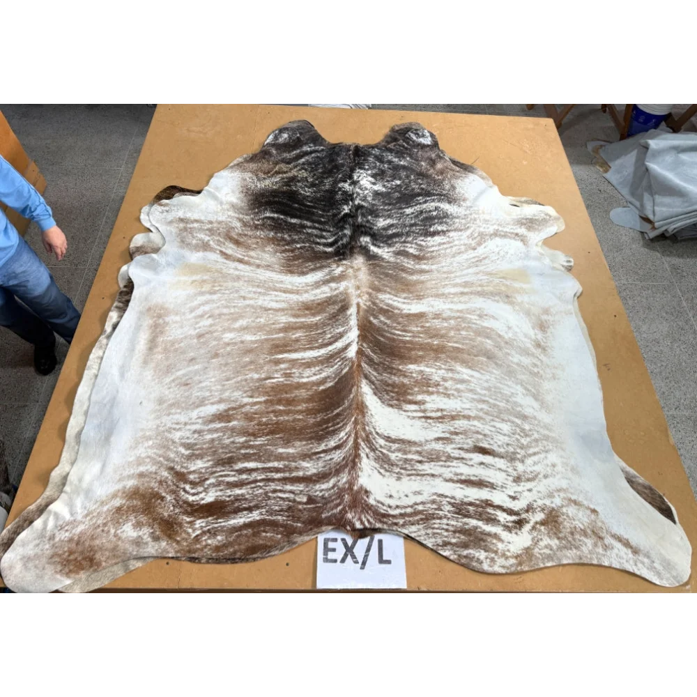 Extra large cowhide rug with brown and white fur pattern and leather texture