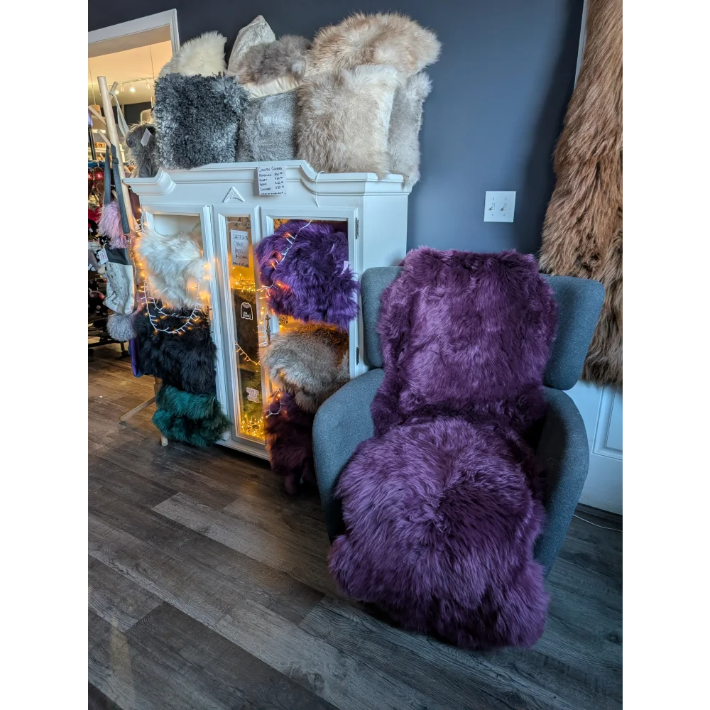 Plush purple faux fur armchair with gorgeous merino sheepskin rug vibes