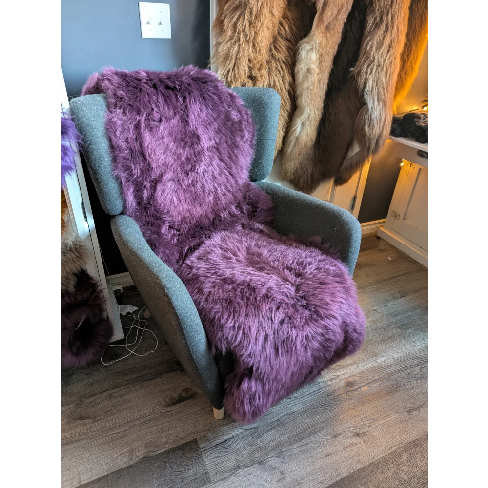 Gorgeous plum purple double sheepskin rug on lavender faux fur throw