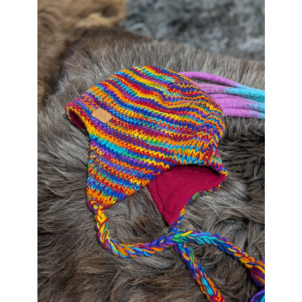 Colorful rainbow rasta hat with fleece lining and braided ties, perfect rasta hat style